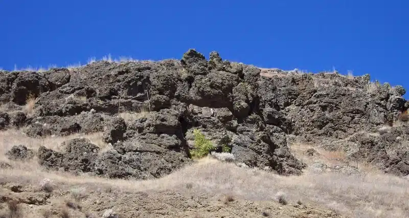Rocky ledge under a blue sky