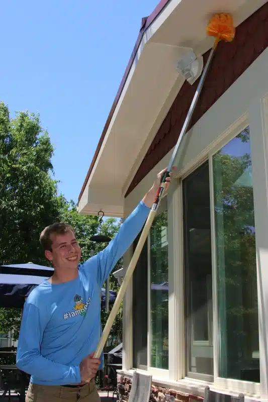 Exterior web removal from home eaves